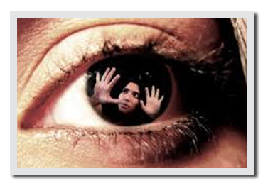 An eyeball with a woman looking out.