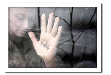Woman with hand up against glass with the word help written on it.