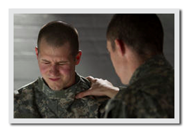 Soldier consoling another soldier.